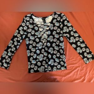 Long sleeve t-shirt with open cross cross front.